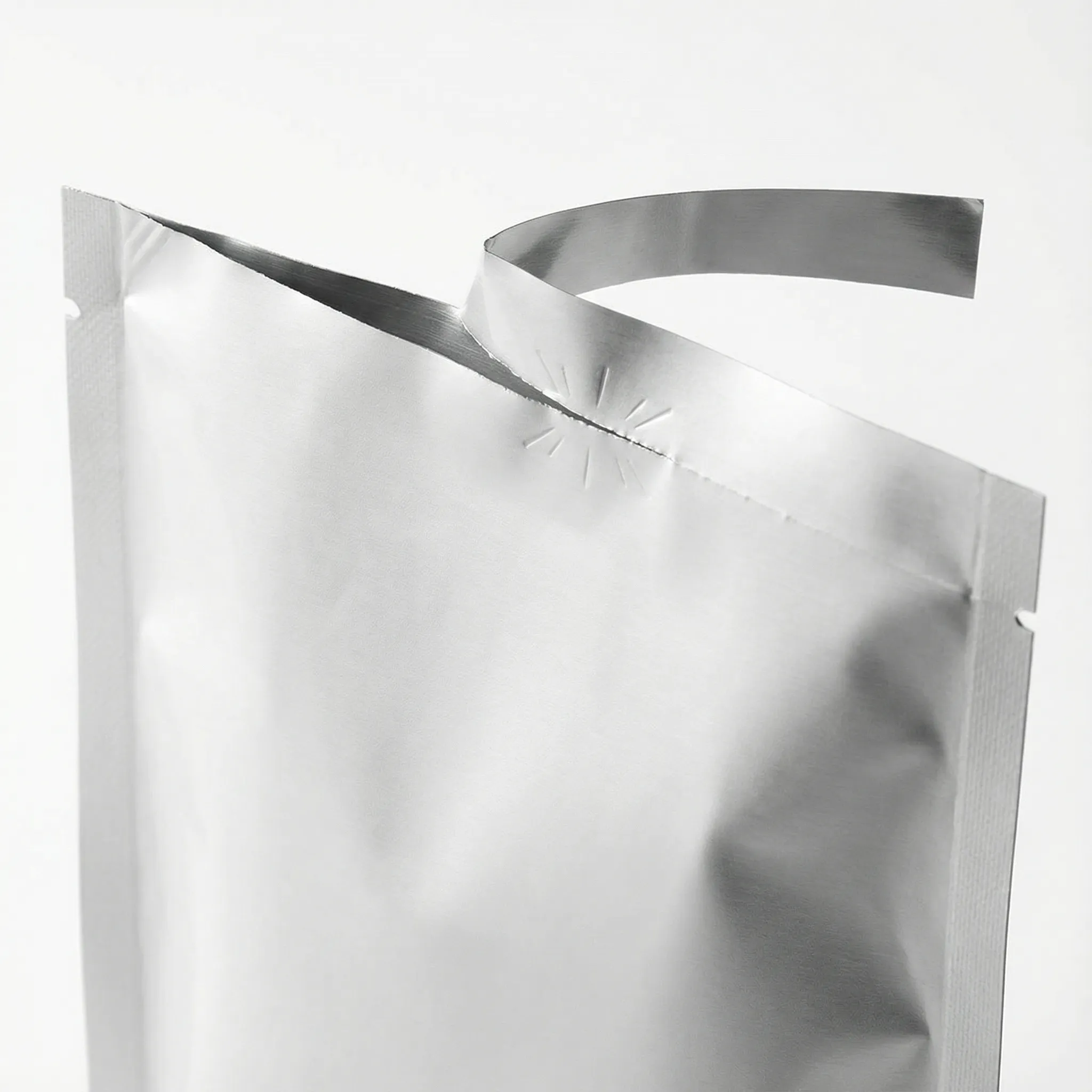Laser-scored easy-tear line on a pouch